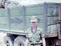 John Girardeau, B Troop forward observer, next to captured NVA truck.